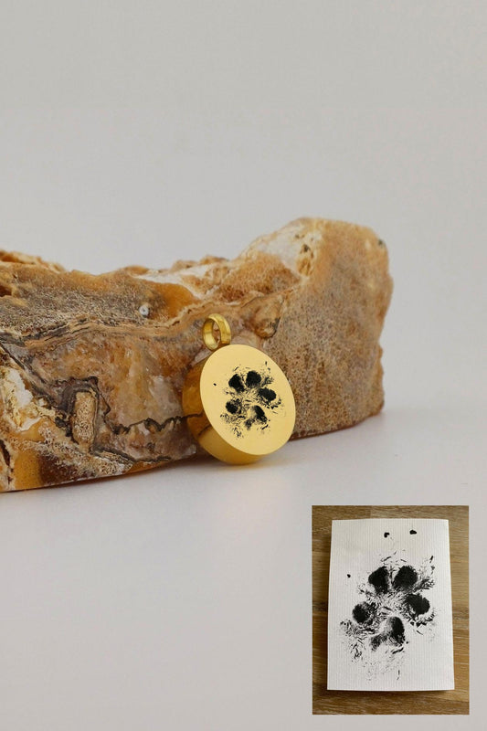 ronde ashanger met pootafdruk goudkleurig